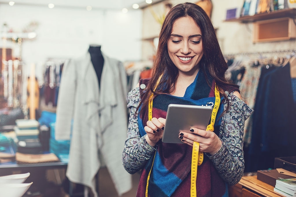 Manager with digital tablet in a fashion store